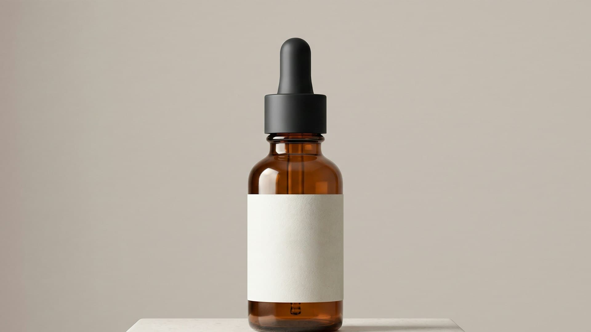 Amber dropper bottle on a stone plinth, keyframe from the Botanica No.7 sample ad